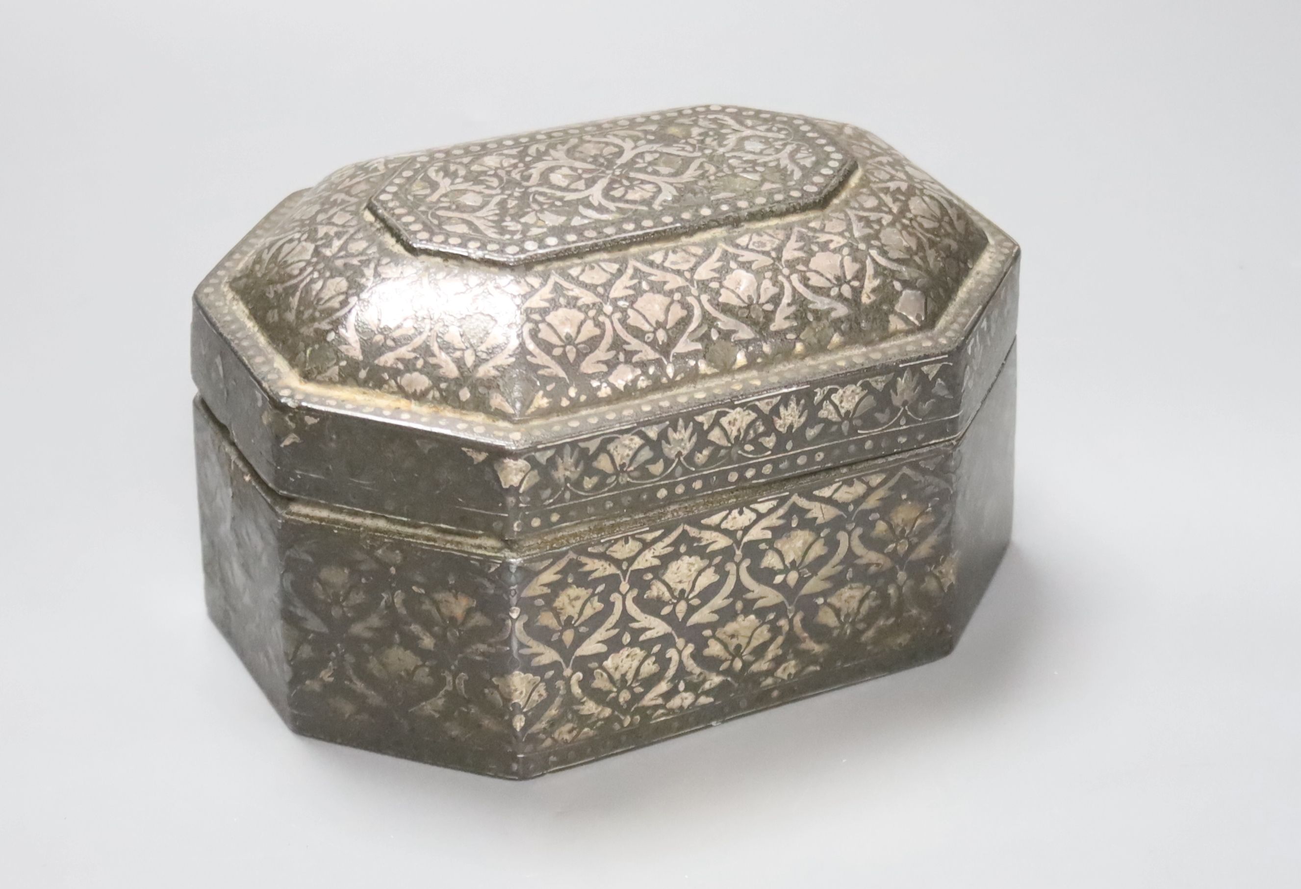 A 19th century Indian Bidri ware octagonal casket, 7cm high, 11x15 cm.